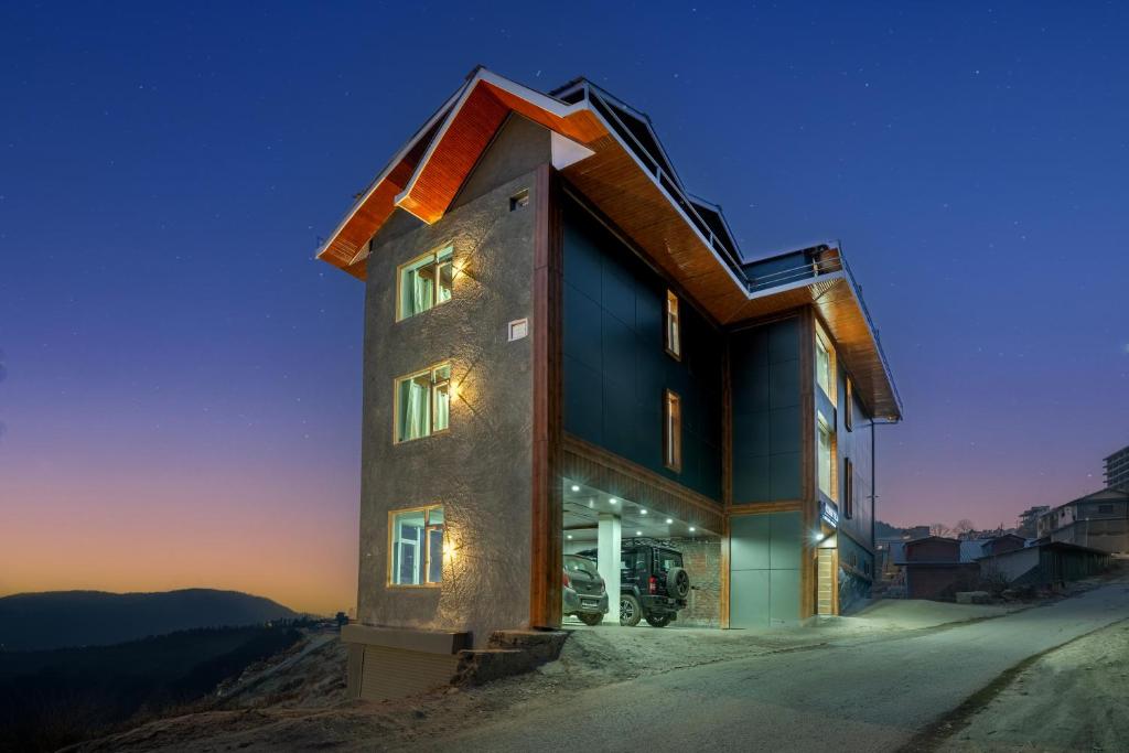 a building with lights on the side of it at Sunrise Villa in Fagu