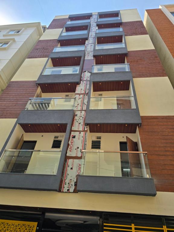 a tall building with balconies on the side of it at Om Sai Ram Coliving in Bangalore