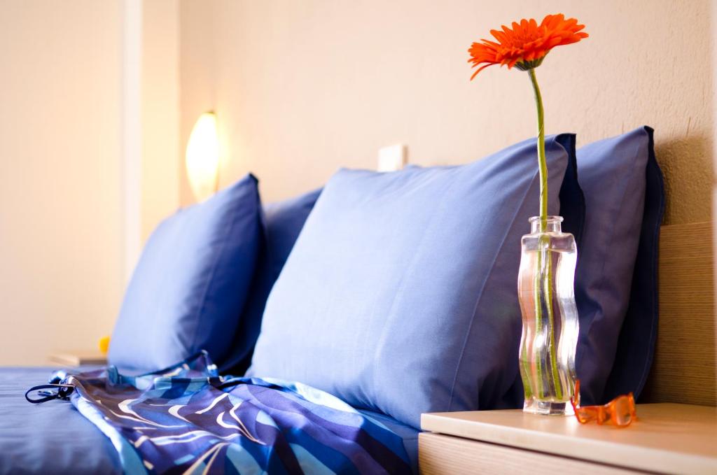 Postel nebo postele na pokoji v ubytování Stratos Hotel