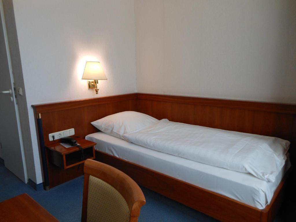 Postel nebo postele na pokoji v ubytování Hotel Pfeffermühle