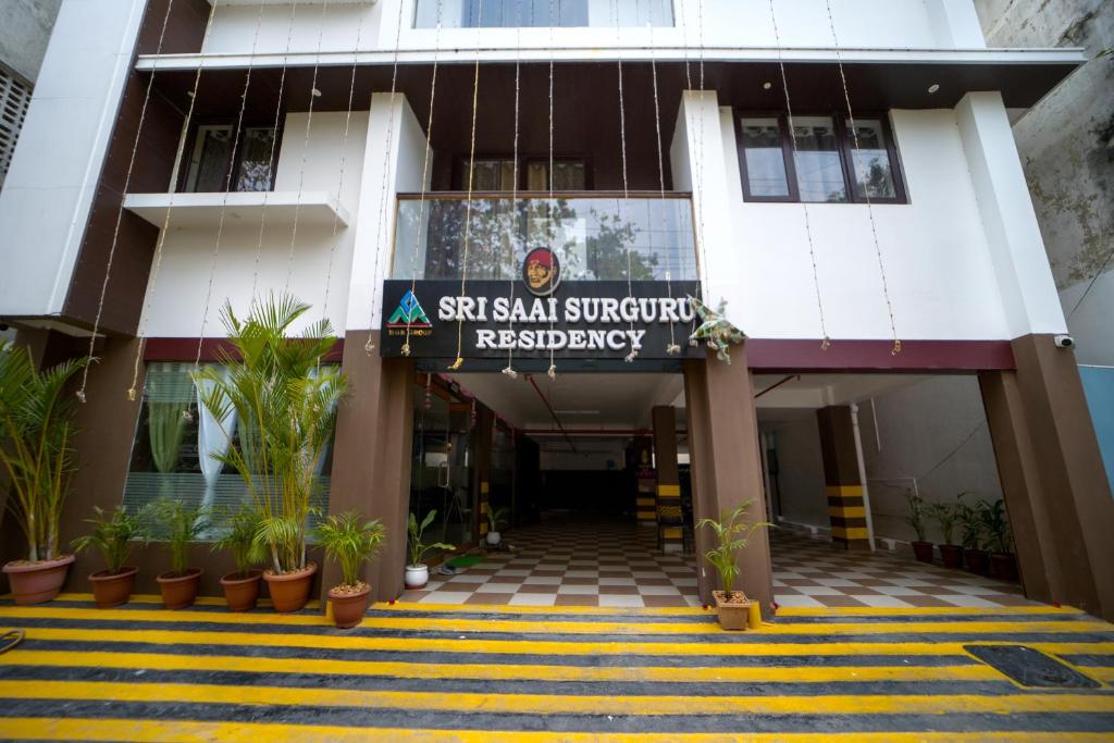 a building with a sign that reads st shar shar superstar residency at Sri Saai Surguru Residency in Pondicherry