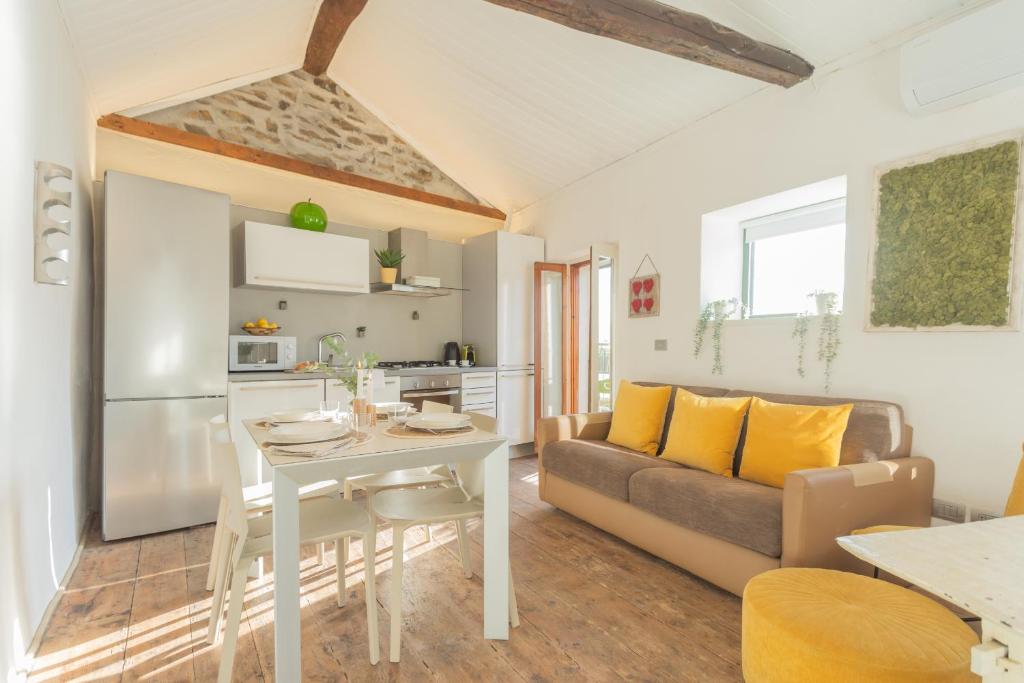a living room with a couch and a table at La Casa di Pietro in Blevio