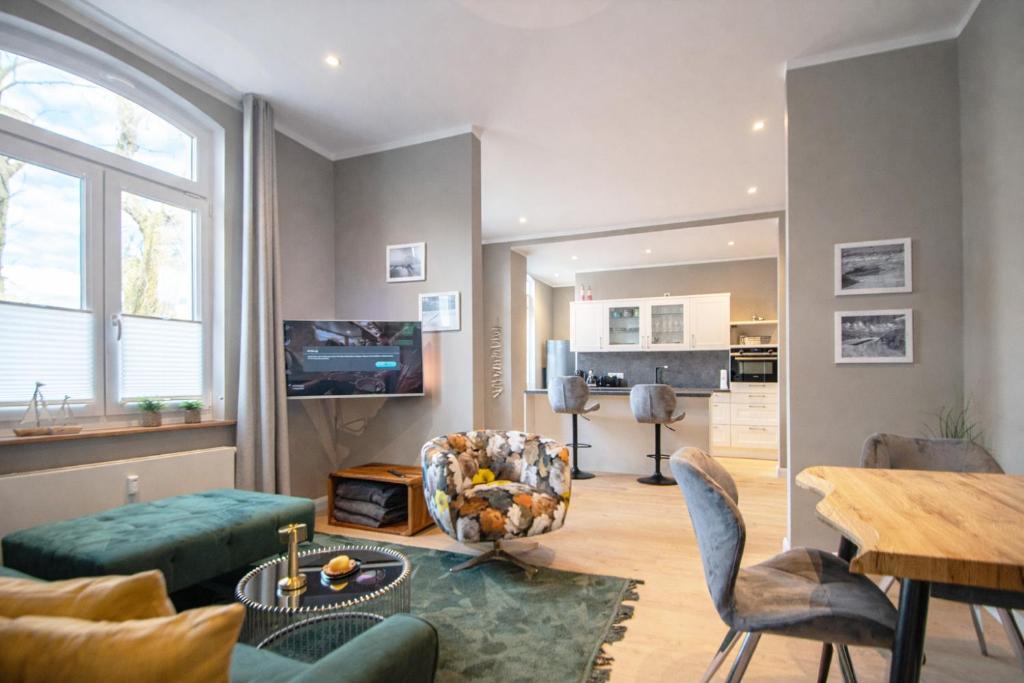 a living room with a couch and a table at Inselrose in Juist