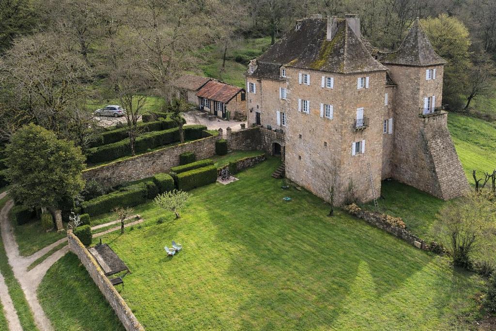an aerial view of an old castle with a yard at Manoir du Boscau, Gilles del Bosc in Prudhomat