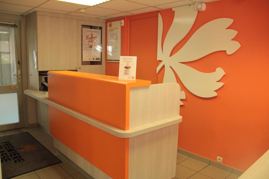 an orange and white counter in a room at Premiere Classe Beauvais in Beauvais