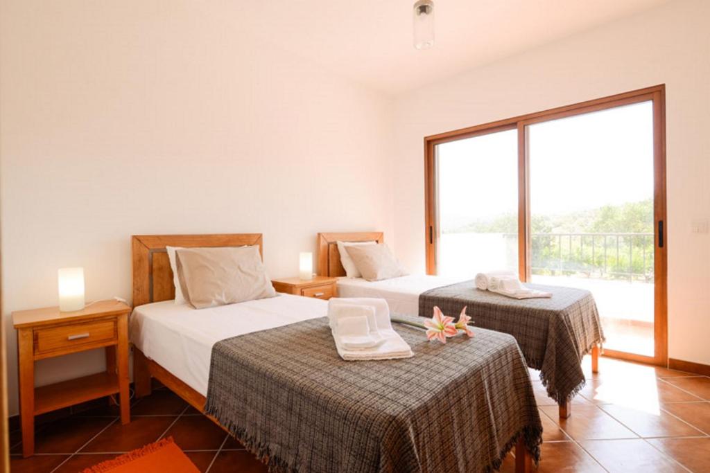 Postel nebo postele na pokoji v ubytování Monte da Ribeira