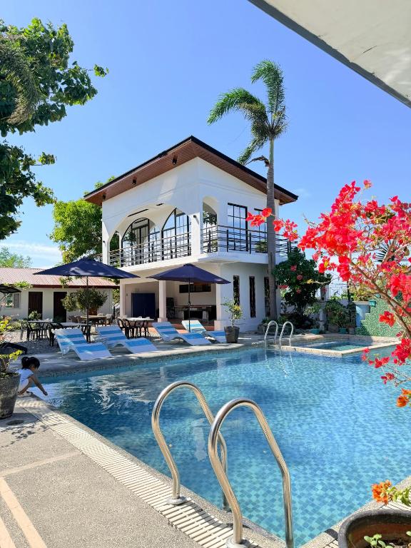 a view of the pool at the resort at Villa de Flynn Private Resort in Bauang