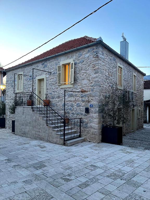 a stone building with stairs and a stair case at Tri srca 2 - De Luxe 2 in Trebinje
