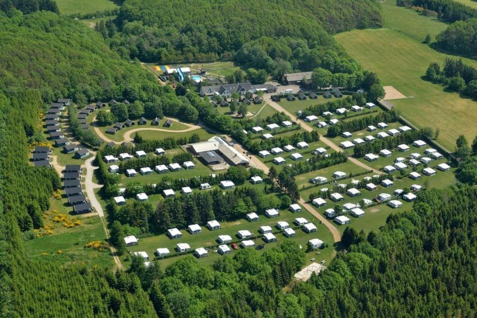 an aerial view of a parking lot with cars at Riis Feriepark in Give
