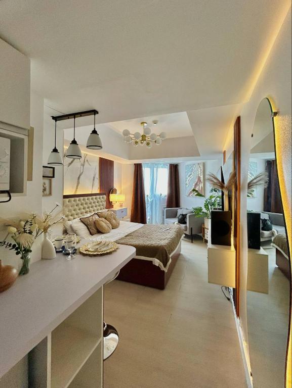 a bedroom with a bed and a table in a room at Azure Luxe Haven by Irene in San Fernando