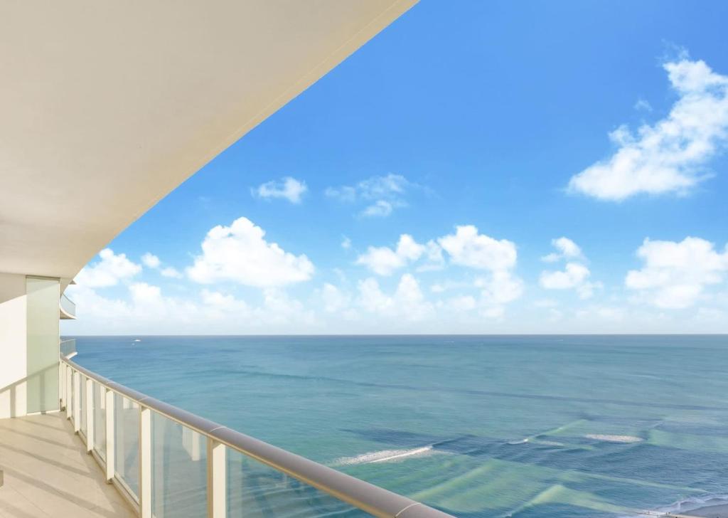 a view of the ocean from the balcony of a building at LYFE Resort Ocean View Penthouse in Hollywood