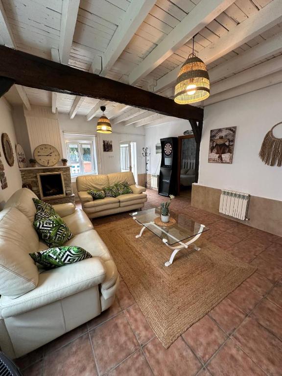 a large living room with couches and a table at Casa en Laredo in Laredo