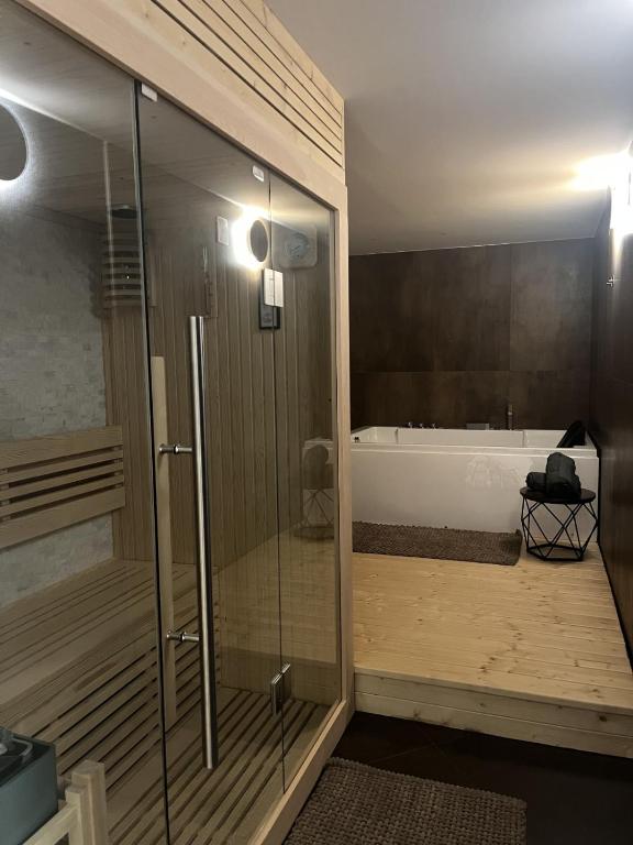 a bathroom with a shower and a bath tub at Domus Europa in Matera