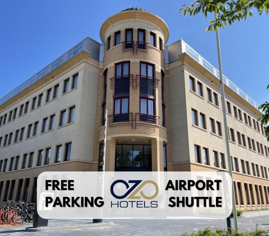 a building with a sign in front of it at OZO Hotels Antares Amsterdam Schiphol Airport in Hoofddorp
