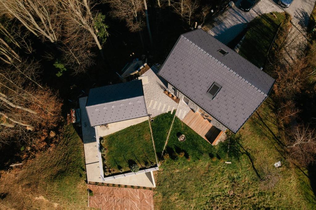 an overhead view of a large house with a roof at Villa Diona in Loka pri Žusmu