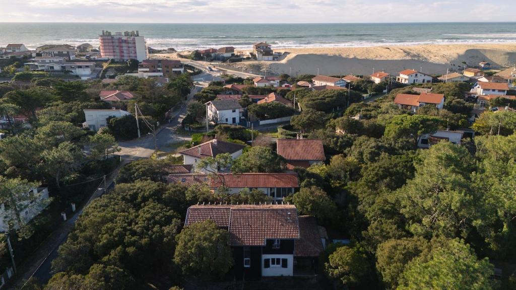an aerial view of a town with the ocean at Maison Capucine in Hossegor