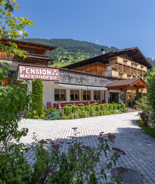 a building with a sign that reads permission makeounter at Pension Mayerhofer in Piesendorf