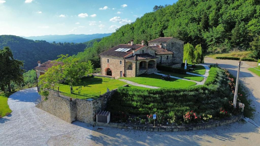 an aerial view of a house on a hill at Borgo Macereto in Dicomano