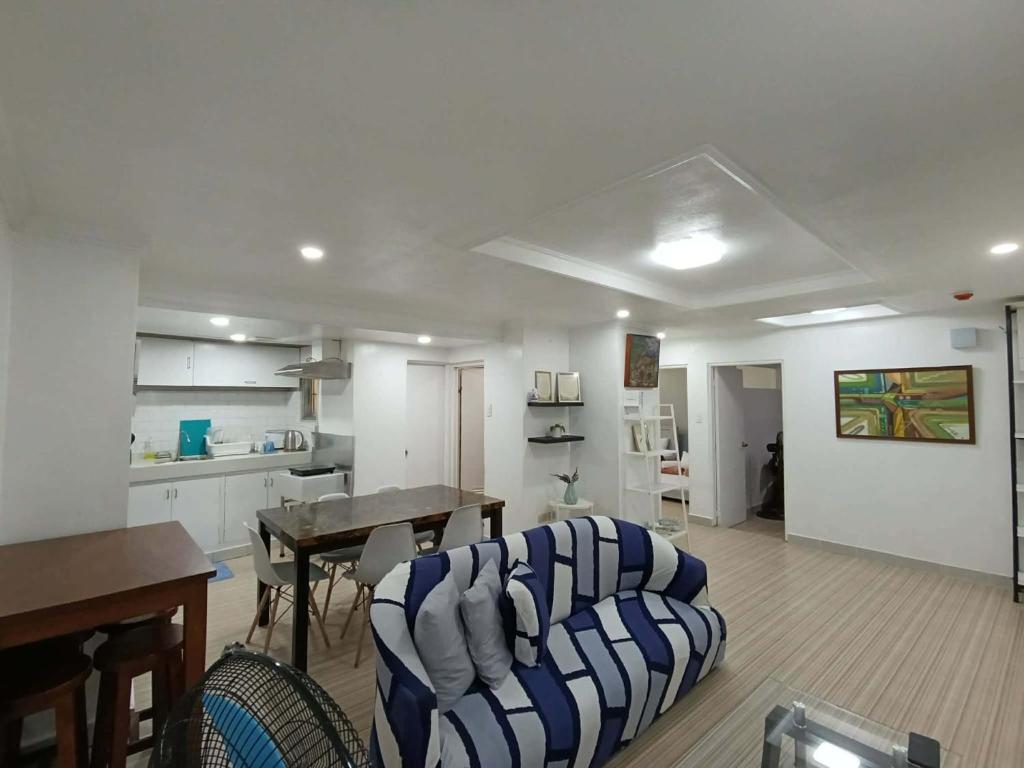 a living room with a couch and a table at Door207 Homestay in Baguio
