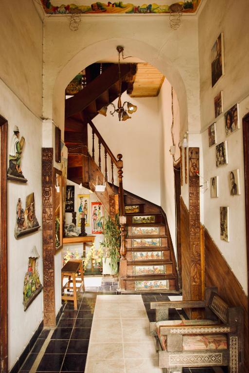 a hallway with a staircase in a house at Le Karthala in Antananarivo