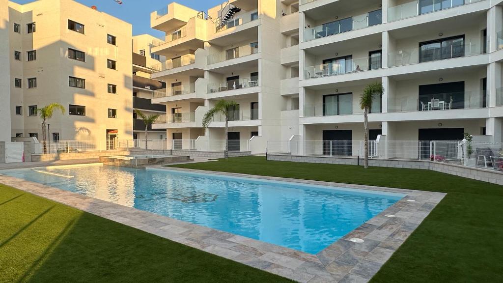 a swimming pool in front of a apartment building at Casa Anna - Velapi - Los Alcázares in San Javier