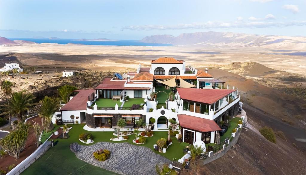 an aerial view of a house in the desert at Casona de Tao in Tiagua