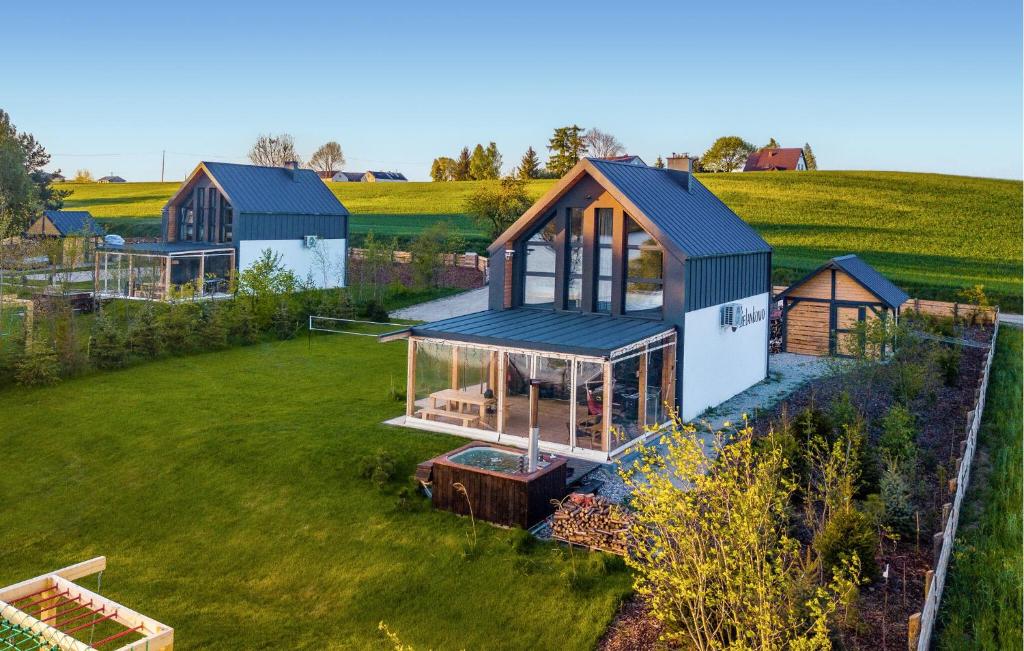 an overhead view of a house in a field at Beautiful Home In Ostrowite With Lake View in Ostrowite