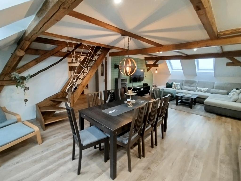 a dining room with a table and chairs at Apartment Elli in Lichtenhain