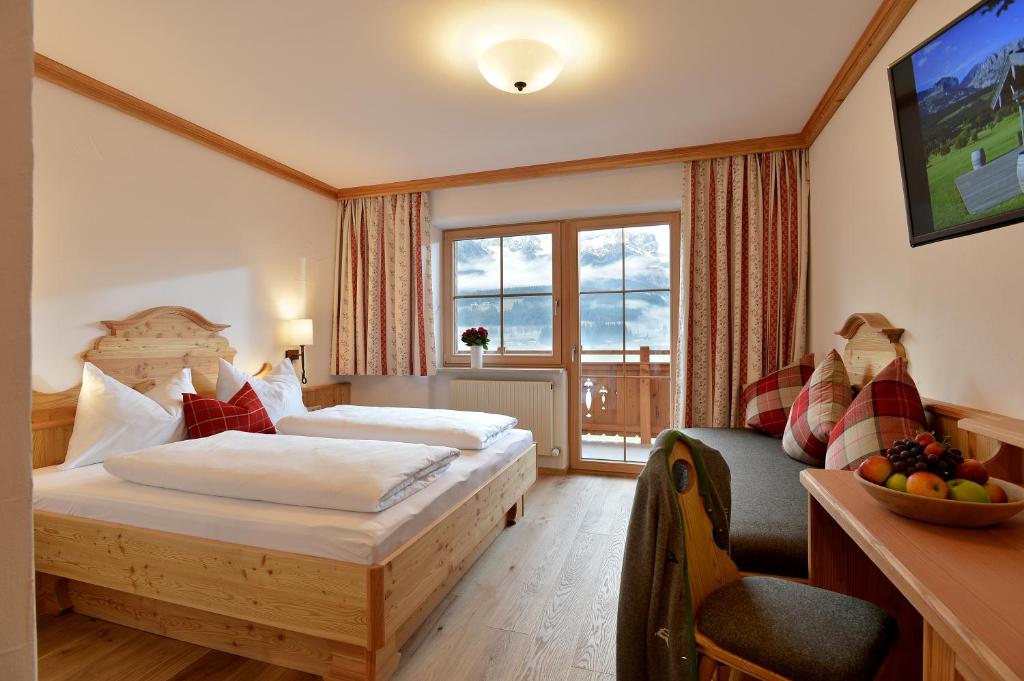 Postelja oz. postelje v sobi nastanitve Hotel Ritterhof Ellmau