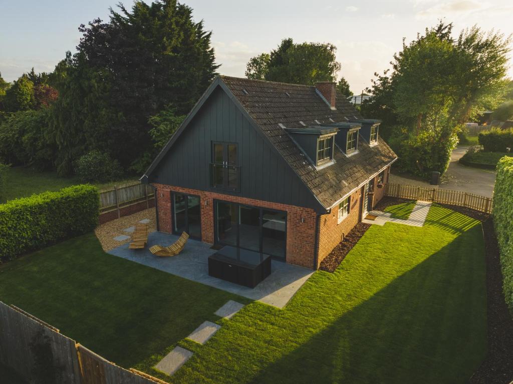an overhead view of a house with a yard at Mill Farm in Gamlingay