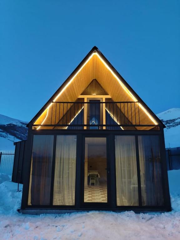a house in the snow with a balcony at Aparan HOUSE in Aparan