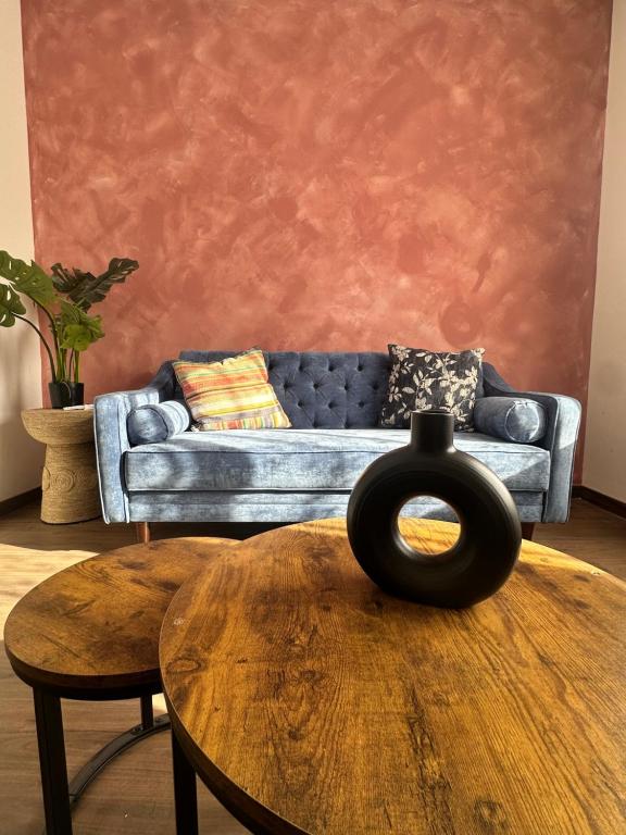 a living room with a couch and a table at Loteria Mexicana in Senecú