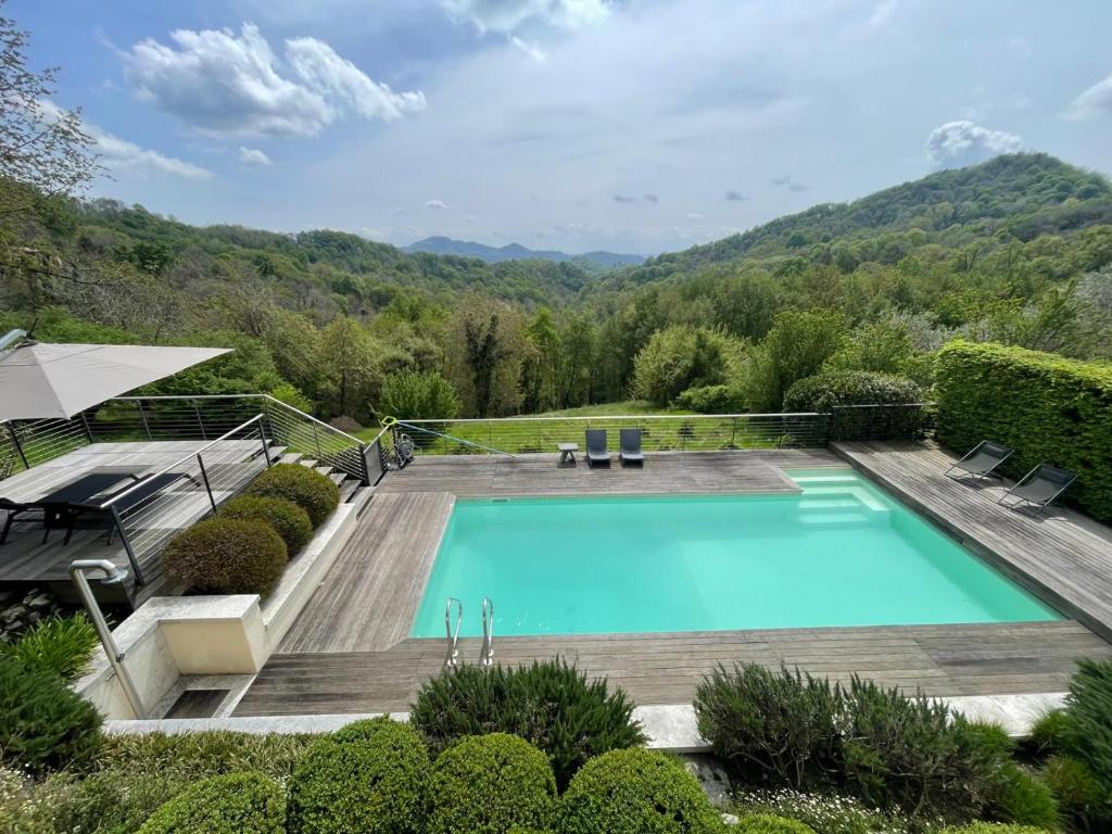 a swimming pool in the middle of a garden at CasAle 1896 in Cavaso del Tomba