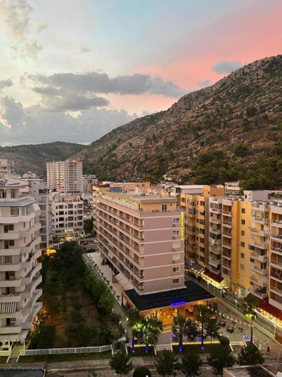 a view of a city with buildings and a mountain at Hotel Adria in Shëngjin