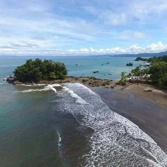 an aerial view of an island in the ocean at Paraisurf colombia in Nuquí