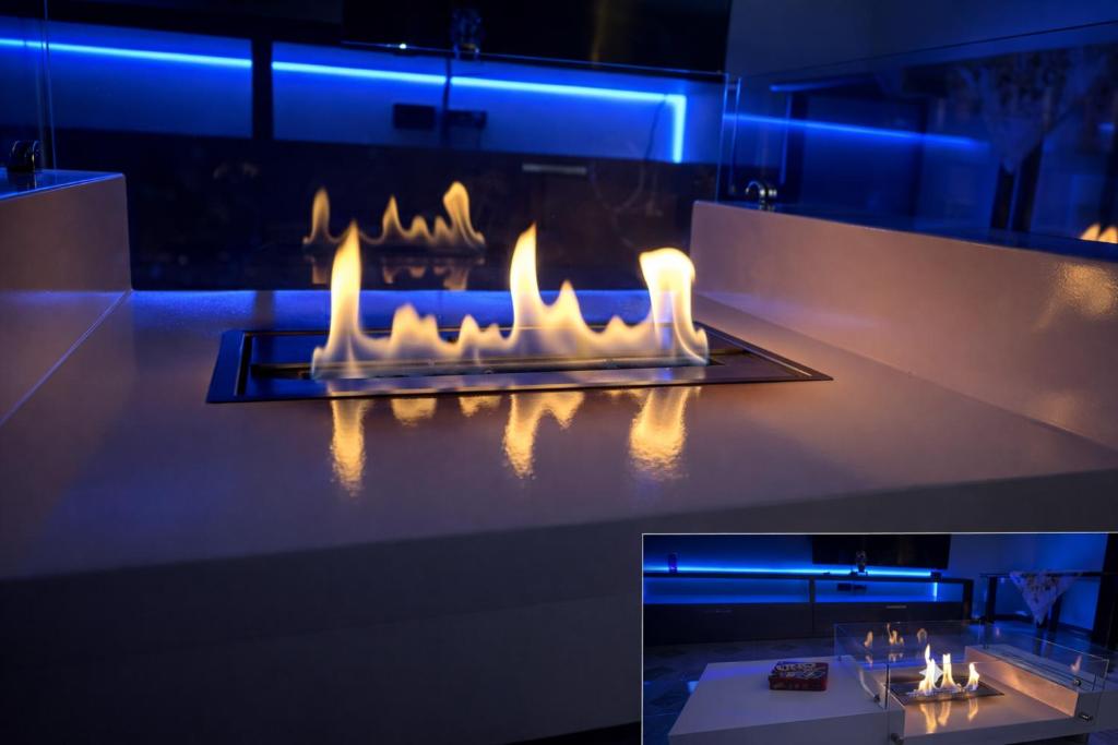 a room with a fireplace with lights on it at Apartment house in the center in Oggiono