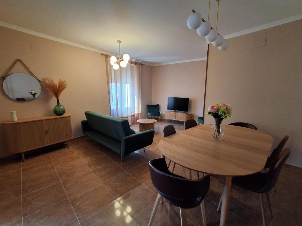 a living room with a table and chairs and a couch at Sol de Infantes in Villanueva de los Infantes