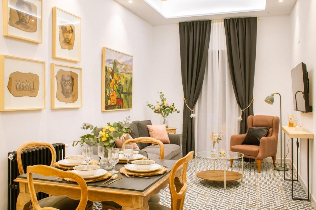 a living room with a table and chairs at Apartamentos Princesa Hayla in Caravaca de la Cruz
