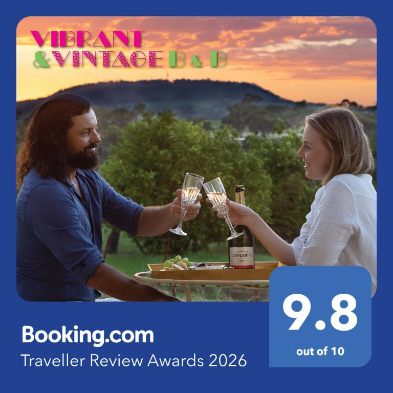 a man and a woman holding glasses of wine at Vibrant & Vintage B & B in Greenmount