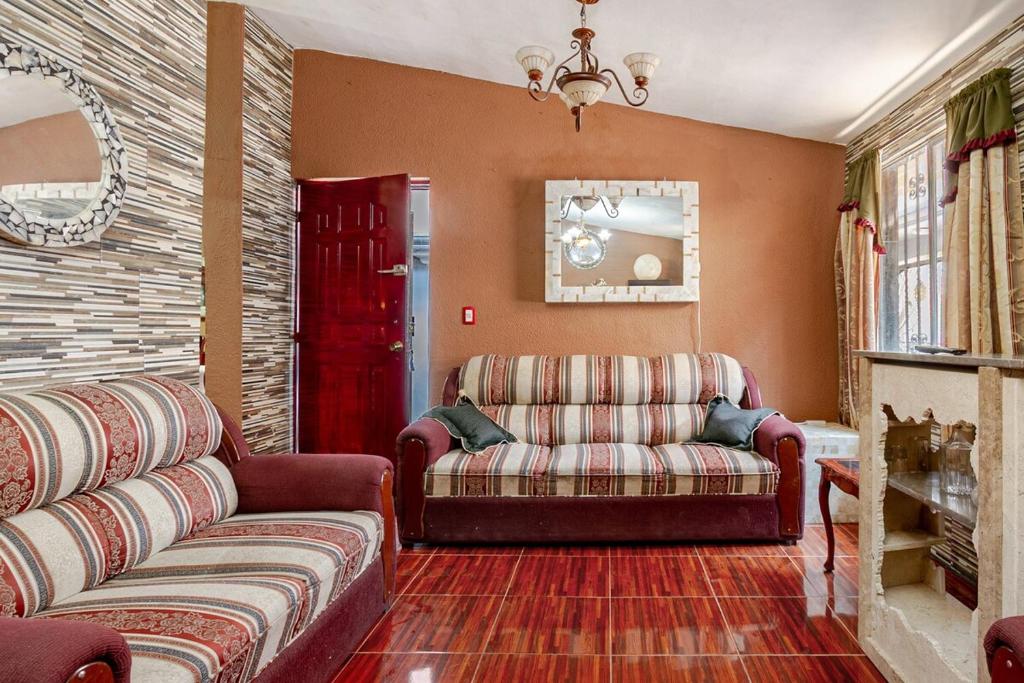 a living room with two couches and a couch at Equipped house in Santa Monica 2nd Section, Qro in Adjuntas
