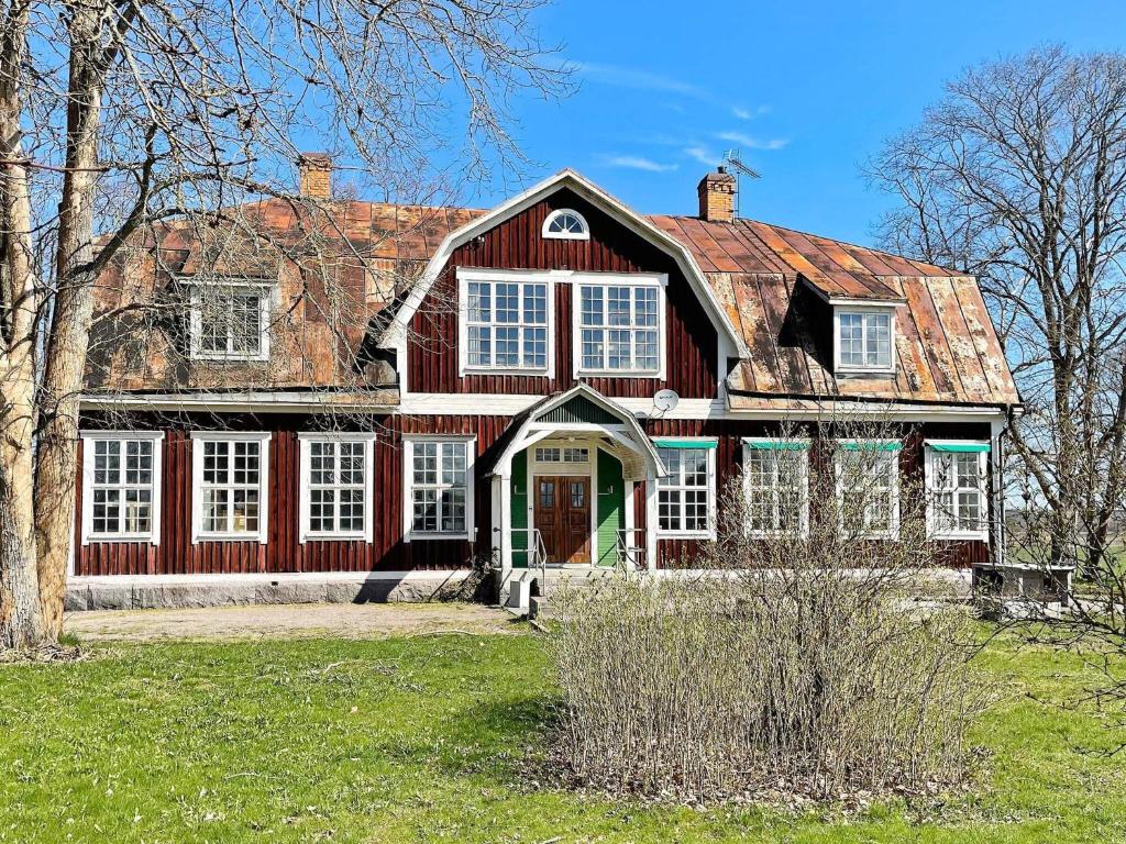 a large red house with a red roof at 9 person holiday home in Mörlunda-By Traum in Mörlunda