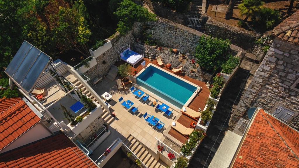 an overhead view of a swimming pool in a house at Boutique Heritage Hotel Blanc & Bleu - Capitano in Herceg-Novi