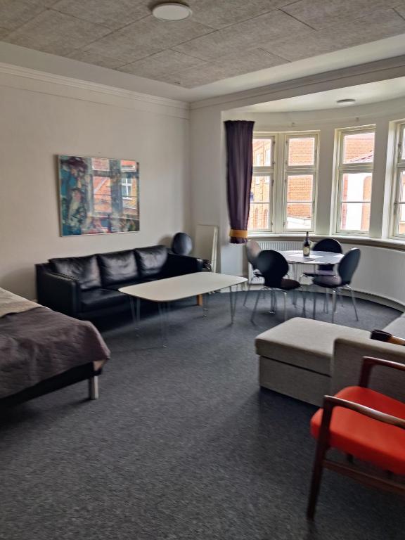 a living room with a couch and a table at JP Apartment Floor 1 in Grindsted