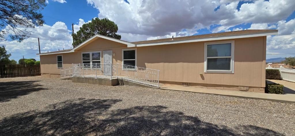 a house that is sitting in a driveway at Spacious Private Room - Workspace - Las Cruces in Las Cruces