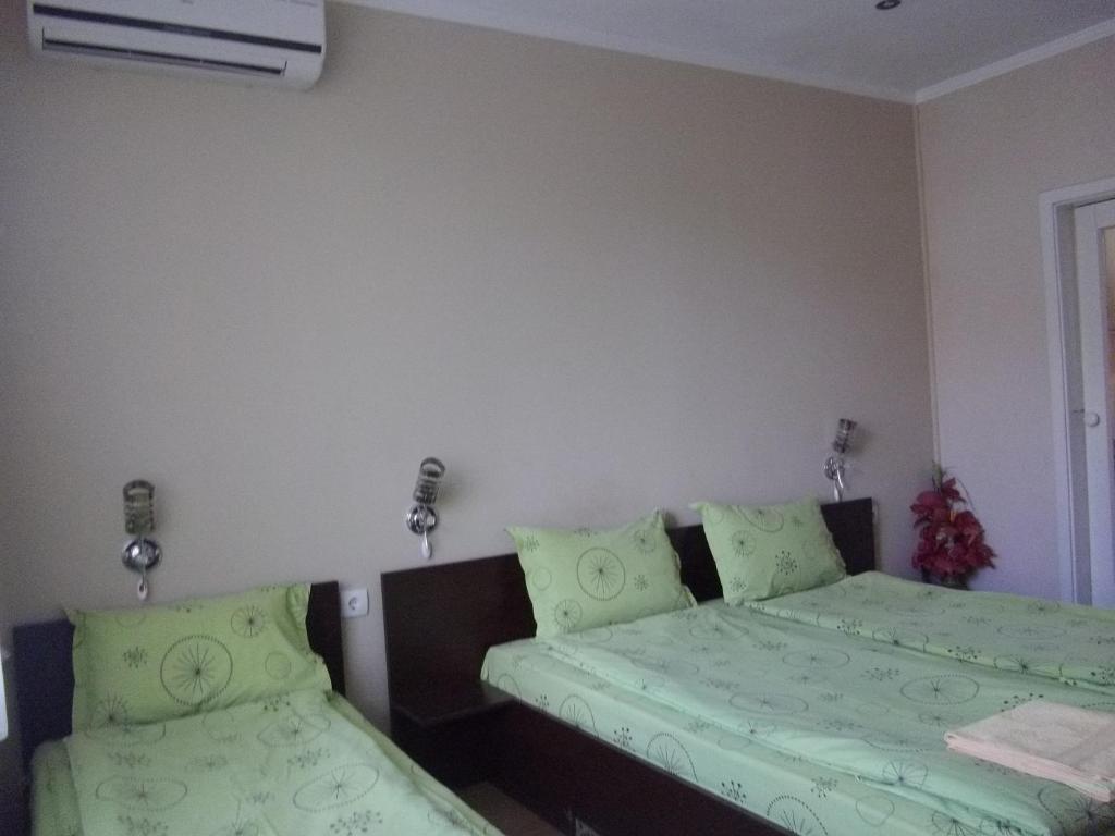 Postel nebo postele na pokoji v ubytování Sakutski House