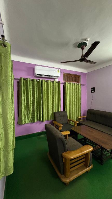 a living room with a couch and a table at Awadh homestay in Varanasi