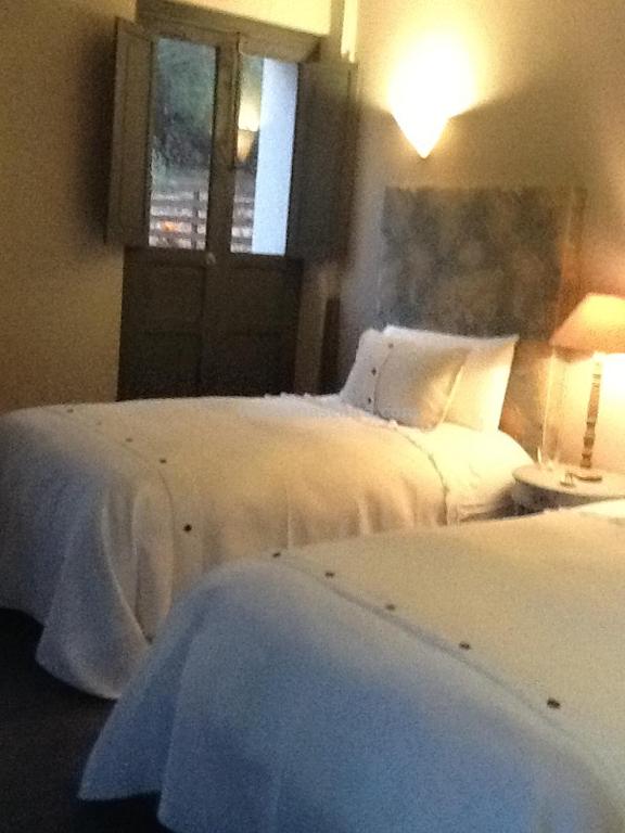 Postel nebo postele na pokoji v ubytování Hotel MasClara
