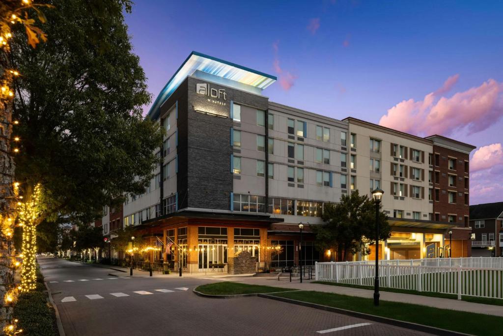 a building with a lit up sign on top of it at Aloft by Marriott Richmond West Short Pump in Short Pump