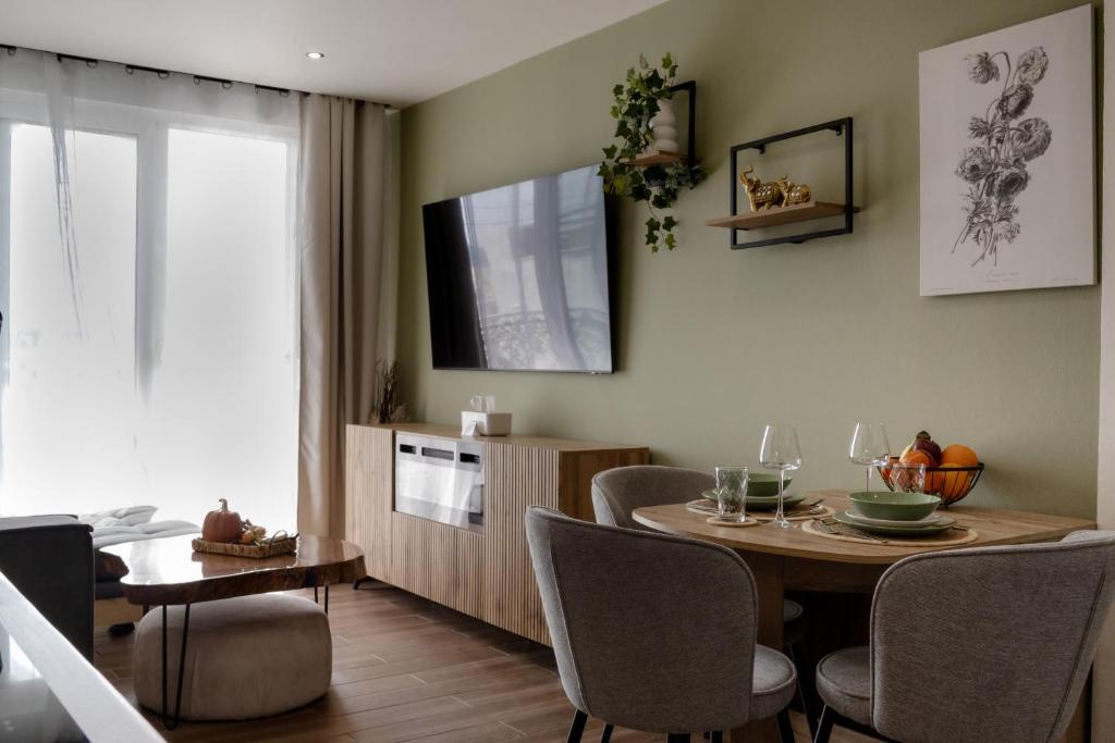 a kitchen and dining room with a table and chairs at El Koulador House in Ialysos