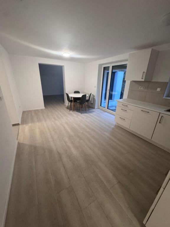 a kitchen and dining room with a table and chairs at Ferienapartments Sternen WOHN 6 in Baiersbronn